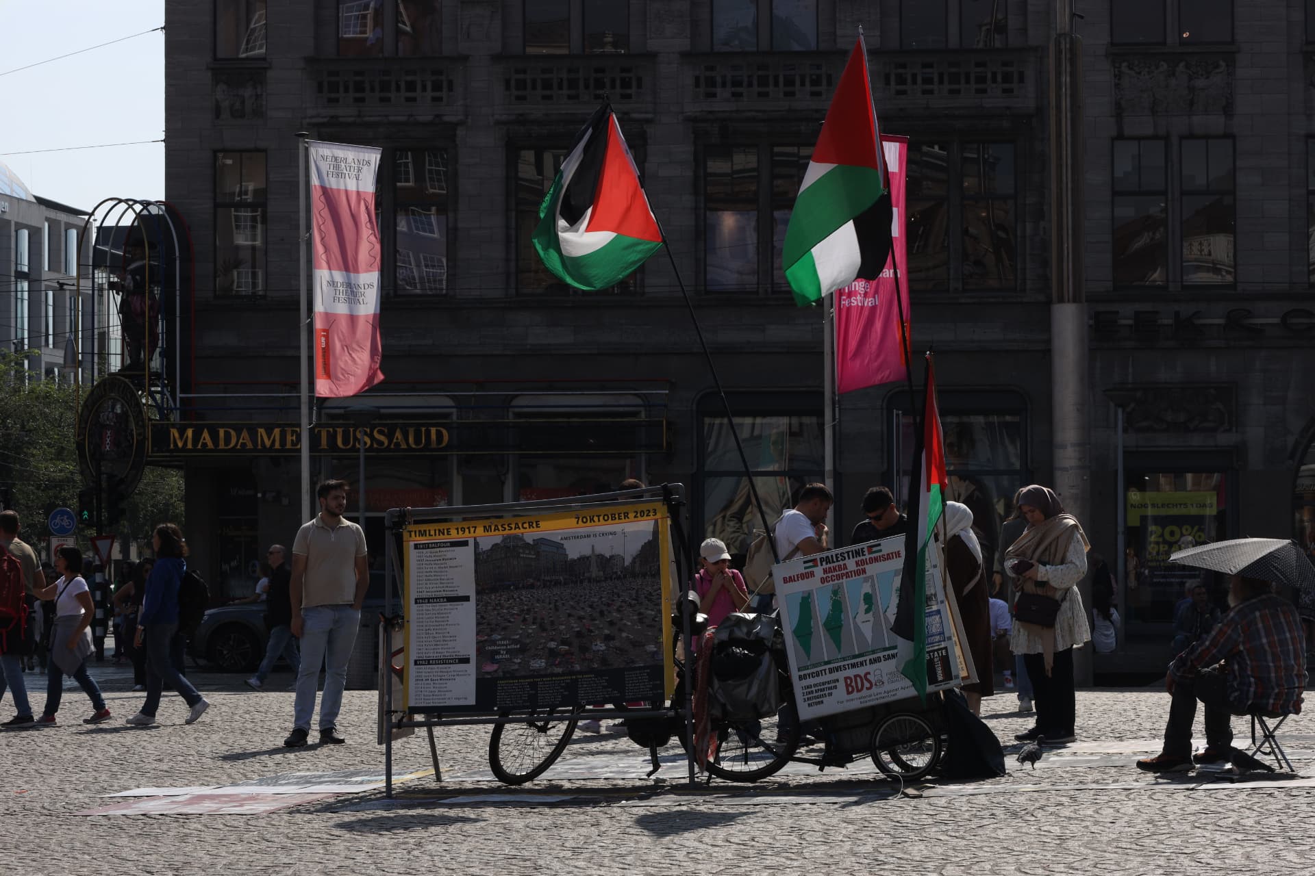 Palestine solidarity stand with flags on Dam Square, Amsterdam