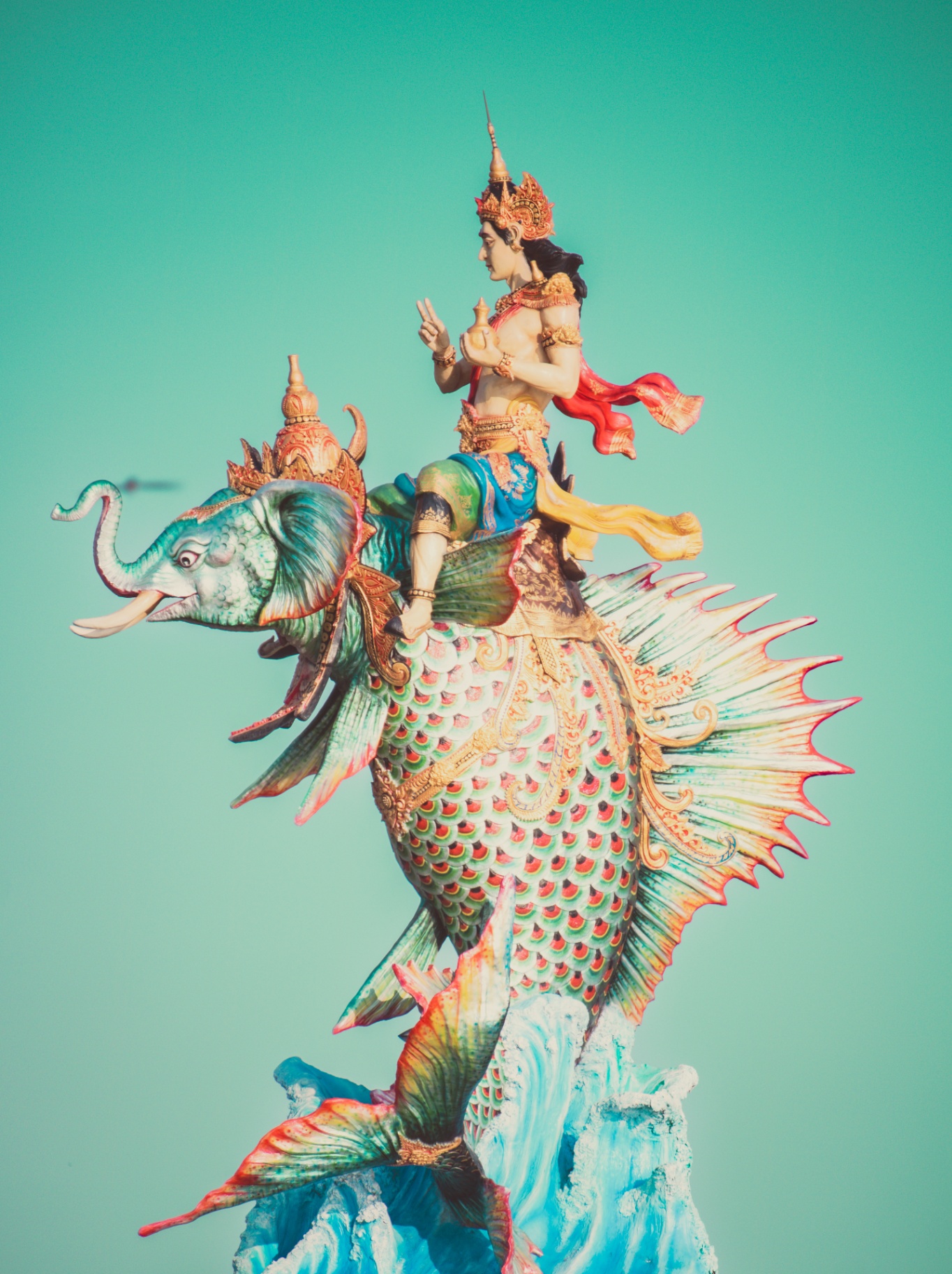 Ornate Thai deity statue riding mythical creature