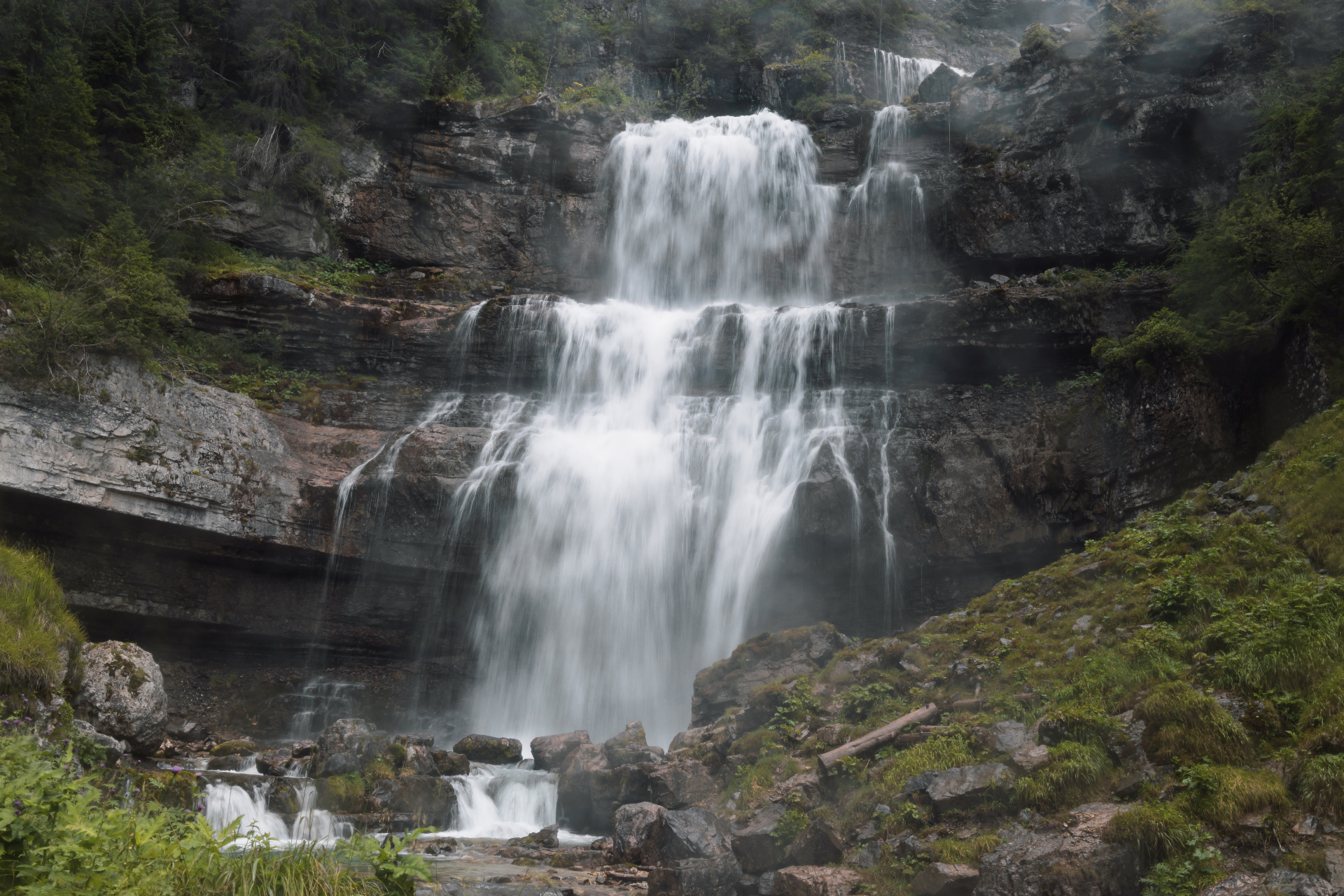 Multi-tiered cascading waterfall in the Dolomites