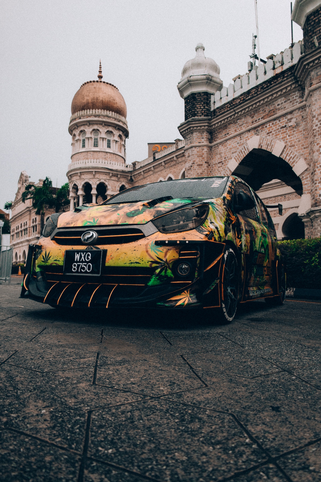 Perodua hatchback with Rasta wrap in Kuala Lumpur