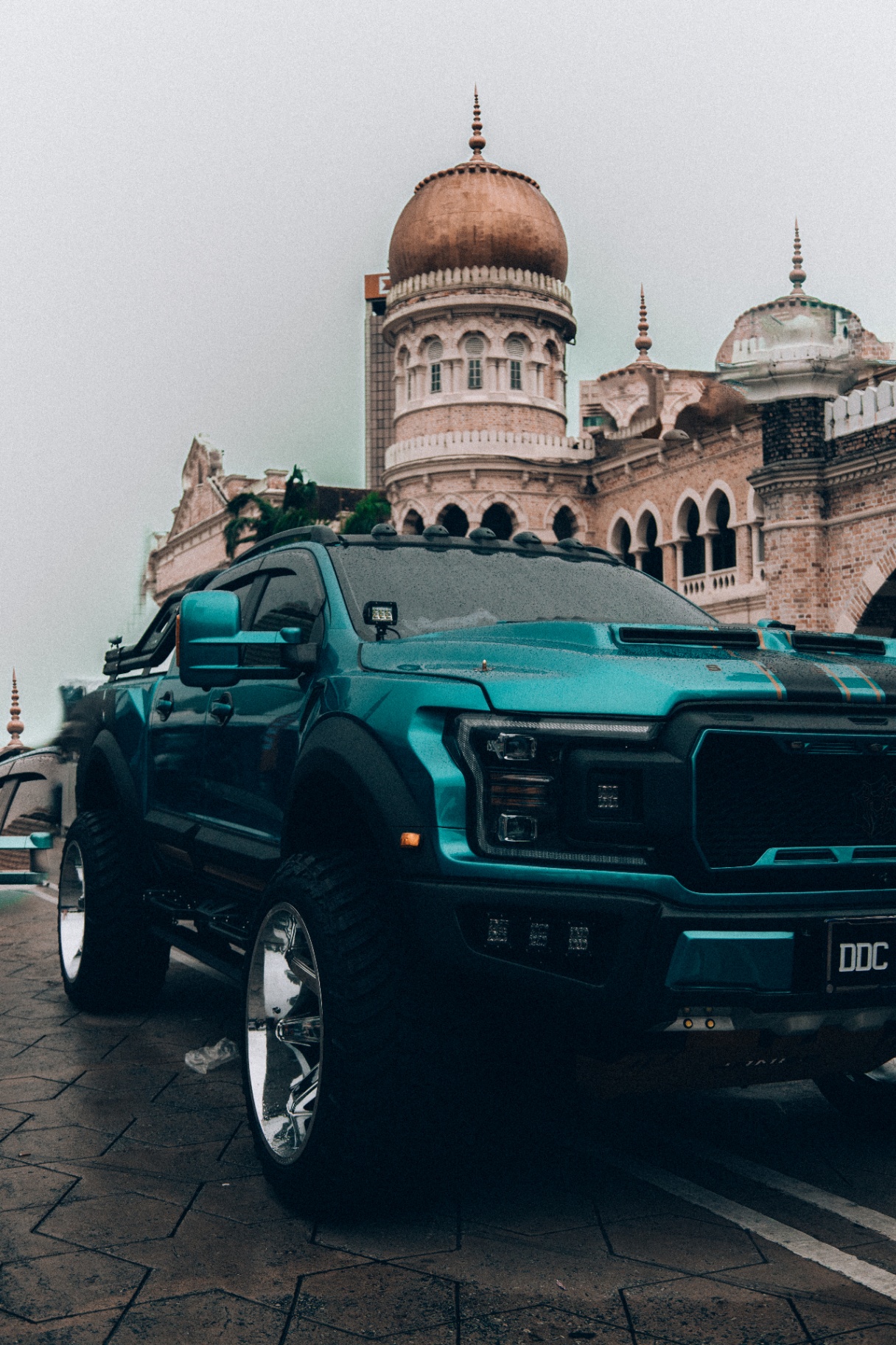 Lifted teal Ford F-150 in front of Sultan Abdul Samad Building
