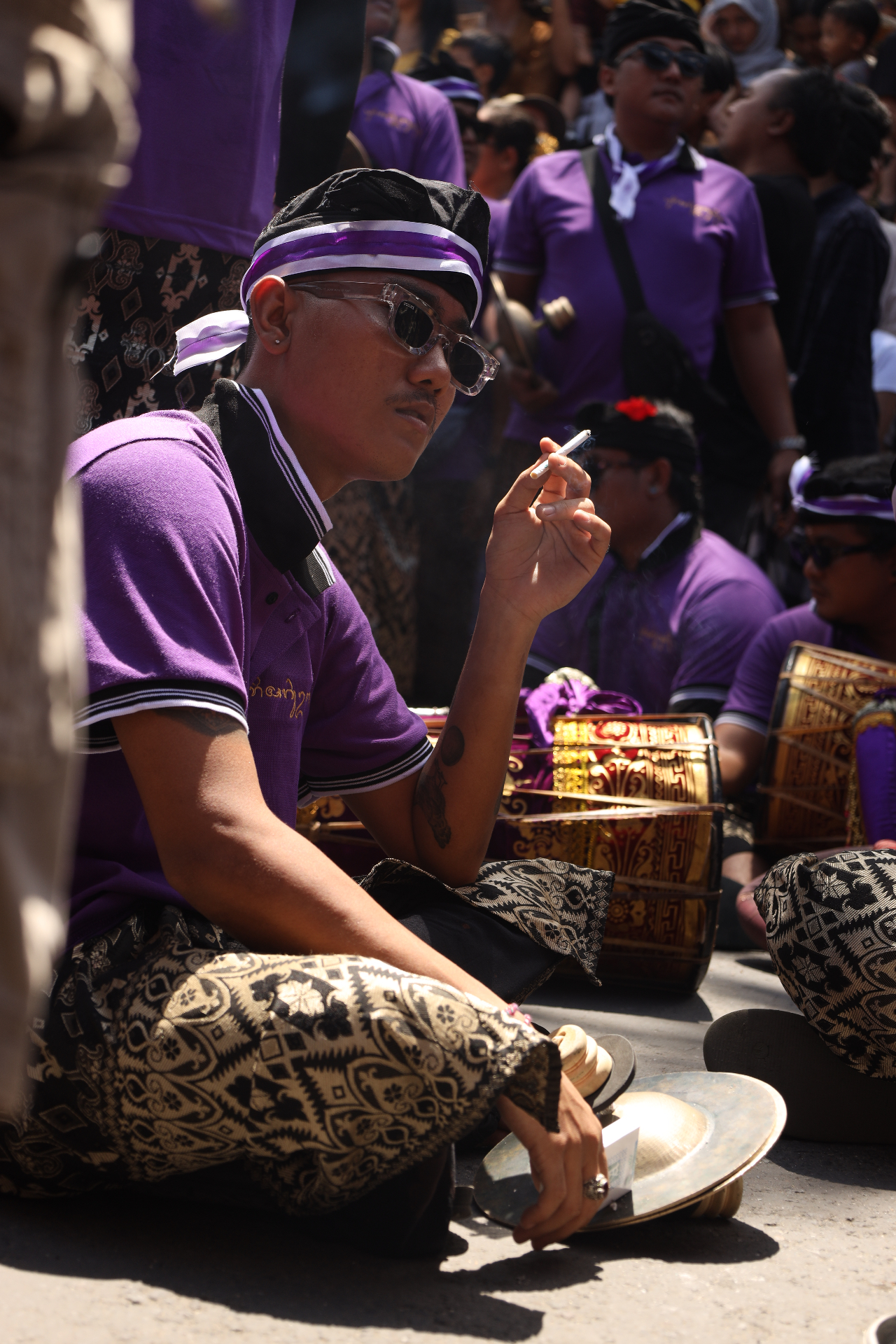 Balinese drummer in traditional dress at ceremony