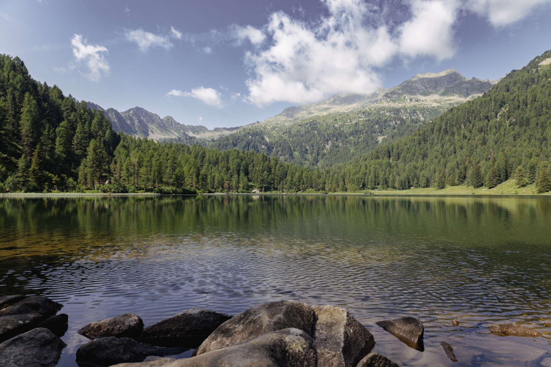 Alpine lake with mountain reflection